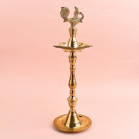 13.5 Inch Brass Peacock Kerala Diya β Handcrafted brass diya featuring an intricate peacock motif, ideal for grand pooja rituals, temple lighting, and traditional dΓ©cor. Indiaβs Largest Pooja Accessories Brand β www.satvikstore.in