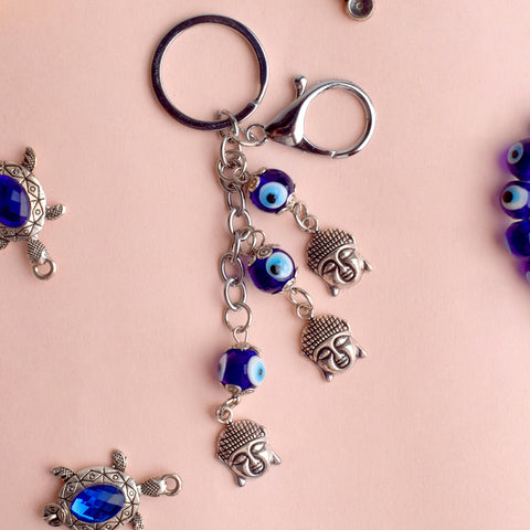 3 Tier Buddha Keychain with Evil Eye β A spiritual and protective charm for keys, bags, or gifts. Indiaβs Largest Pooja Accessories Brand β www.satvikstore.in