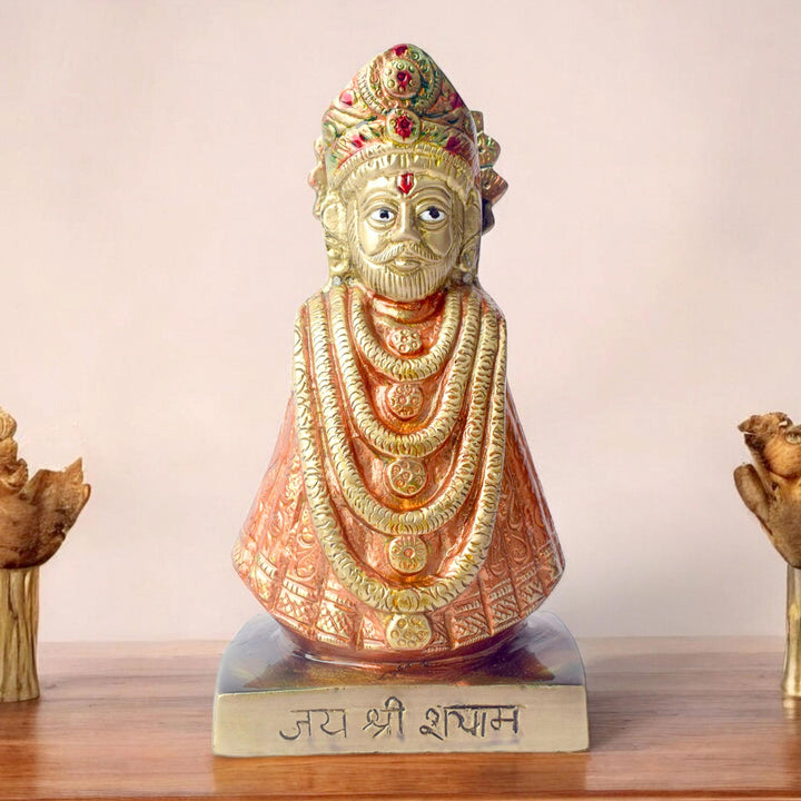 This 6.3-inch Khatu Shyam idol is a symbol of divine grace, devotion, and spiritual protection. Crafted with exquisite detail, it beautifully captures the serene expression of Lord Khatu Shyam, a revered deity known for bestowing blessings of prosperity, health, and happiness upon his devotees.