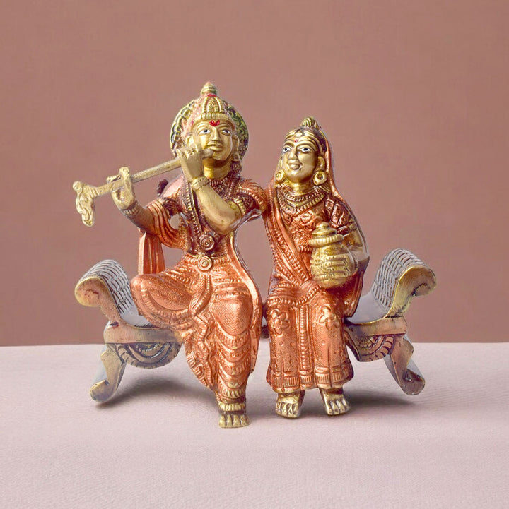 The 4.7 Inch Graceful Sitting Radha Krishna on Bench β A Spiritual Masterpiece is a beautifully crafted idol that captures the essence of divine love and serenity. This exquisite piece features Radha and Krishna seated gracefully on a bench, symbolizing their eternal bond and peaceful companionship. Krishna, with his flute, and Radha, with a serene expression, reflect the harmonious union of the divine couple.