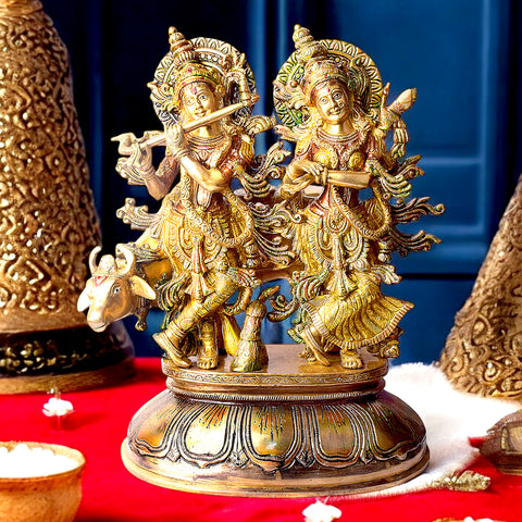 This Lovely Radha Krishna with Cow Colorful Brass Idol beautifully portrays the divine love and grace of Radha and Krishna, accompanied by the sacred cow. Handcrafted from high-quality brass and adorned with vibrant colors, this idol exudes spiritual charm and elegance.