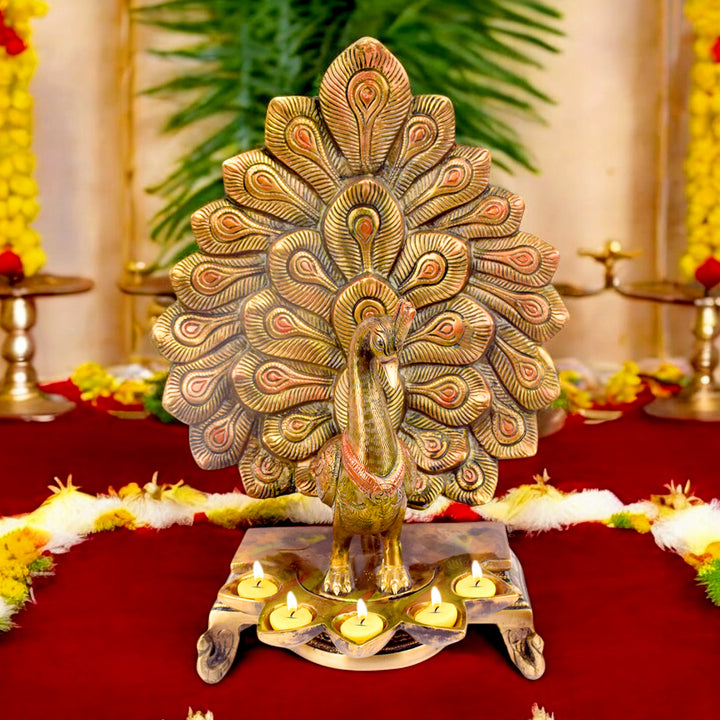 Satvik Stores Presents Stylish Peacock Panch Diya. Any festive occasion will be made wonderfully auspicious by the grace and beauty of the Peacock Brass Handcrafted Hanging Diya. Given that it was made by hand, the piece's abnormalities and flaws only serve to enhance Diya's allure and charisma.