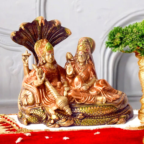 Beautifully crafted 6.1-inch Sacred Brass Vishnu Laxmi Statue featuring Lord Vishnu and Goddess Laxmi in divine form, seated together on an ornate pedestal, symbolizing wealth, protection, and spiritual harmonyβperfect for temple, pooja room. No.1 Brass Idol Store www.satvikstore.in