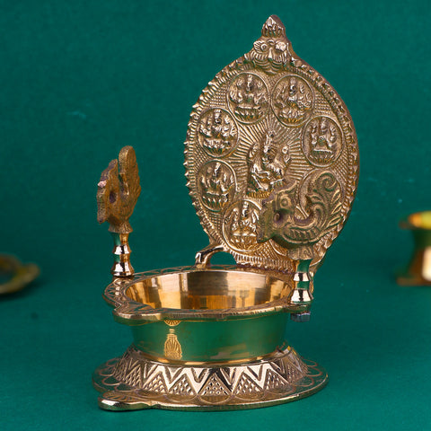 Beautifully engraved Brass Ashtalaxmi Diya featuring intricate depictions of the eight forms of Goddess Lakshmi, designed for auspicious rituals, festive decor, and spiritual ambience in homes and temples. Indiaβs Largest Pooja Accessories Brand β www.satvikstore.in