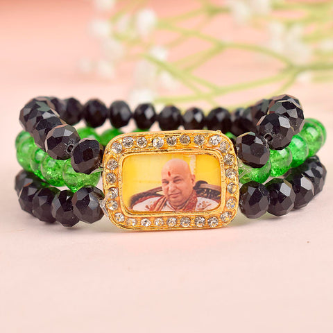 Black & Green Triple Layer Guruji Swaroop Bracelet featuring sleek black beads with vibrant green middle layer and Jai Guruji Swaroop β perfect for spiritual wear, meditation, and gifting. Indiaβs Largest Pooja Accessories Brand β www.satvikstore.in