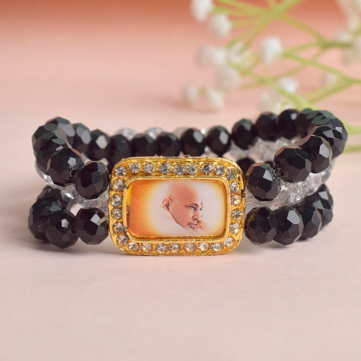 Black & Grey Triple Layer Guruji Swaroop Bracelet featuring sleek black beads with a sophisticated grey middle layer and Jai Guruji Swaroop β perfect for spiritual wear, meditation, and gifting. Indiaβs Largest Pooja Accessories Brand β www.satvikstore.in