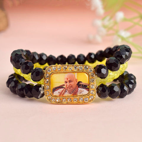 Black & Neon Yellow Triple Layer Guruji Swaroop Bracelet featuring sleek black beads with electric neon yellow middle layer and Jai Guruji Swaroop β perfect for spiritual wear, meditation, and gifting. Indiaβs Largest Pooja Accessories Brand β www.satvikstore.in