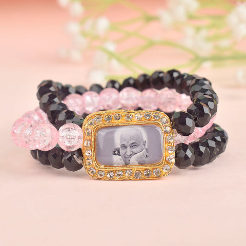 Black & Pink Triple Layer Guruji Swaroop Bracelet featuring sleek black beads with a vibrant pink middle layer and Jai Guruji Swaroop β perfect for spiritual wear, meditation, and gifting. Indiaβs Largest Pooja Accessories Brand β www.satvikstore.in