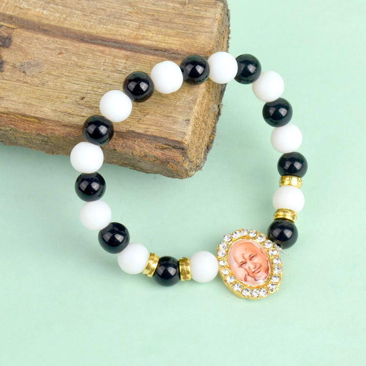Black & White Beads Single Layer Guruji Swaroop Bracelet featuring elegant contrast beads and Jai Guruji Swaroop β ideal for spiritual wear, meditation, and gifting. Indiaβs Largest Pooja Accessories Brand β www.satvikstore.in