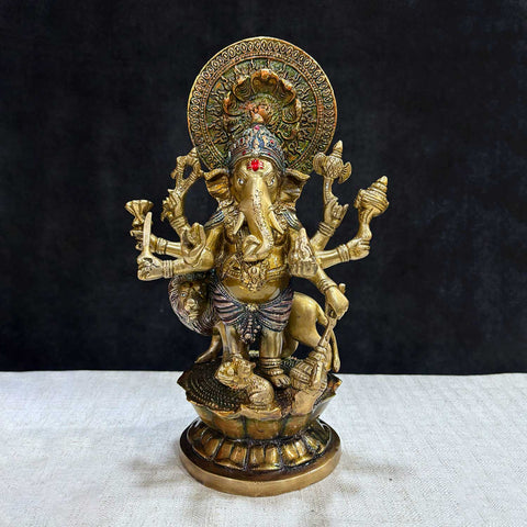The "11.6 Inch Ganesh Idol" is a majestic and detailed representation of Lord Ganesha, embodying divine presence, prosperity, and new beginnings. Standing at 11.6 inches tall, this idol features intricate craftsmanship, capturing Ganeshaβs serene expression and symbolic attributes, including his axe, lotus, and modak.