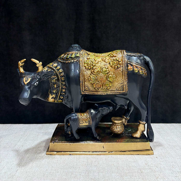 This 6.7-inch Kamdhenu cow figurine is a beautiful representation of purity, prosperity, and spiritual blessings. Known as the divine cow in Hindu mythology, Kamdhenu is believed to grant every wish and bring abundance to its devotees. Crafted with intricate details, this figurine exudes a sense of holiness and serenity. India's Largest Puja Accessories Brand - Satvik No. 1 Brass Idol Collection