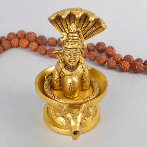 4.7 Inch Brass Shivalingam and Sheshnag Figurine showcasing Lord Shivaβs sacred lingam with the protective hood of Sheshnag β a divine symbol of power and cosmic energy. No.1 Brass Idol Store www.satvikstore.in