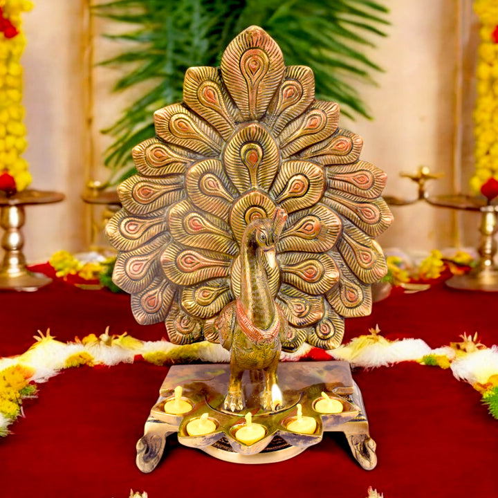 Satvik Stores Presents Stylish Peacock Panch Diya. Any festive occasion will be made wonderfully auspicious by the grace and beauty of the Peacock Brass Handcrafted Hanging Diya. Given that it was made by hand, the piece's abnormalities and flaws only serve to enhance Diya's allure and charisma.