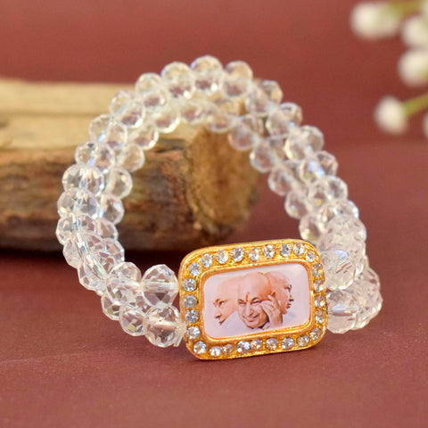 Clear Shiny Beads Single Layer Guruji Swaroop Bracelet featuring sparkling clear beads and Jai Guruji Swaroop β perfect for minimalist spiritual wear, meditation, and gifting. Indiaβs Largest Pooja Accessories Brand β www.satvikstore.in