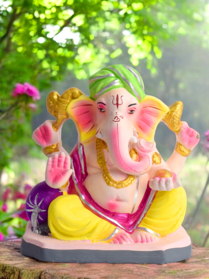 Colorful 6 Inch eco-friendly Ganesha idol seated in Padmasana pose, ideal for Ganesh Chaturthi puja and home decor. India’s Largest Pooja Accessories Brand – www.satvikstore.in