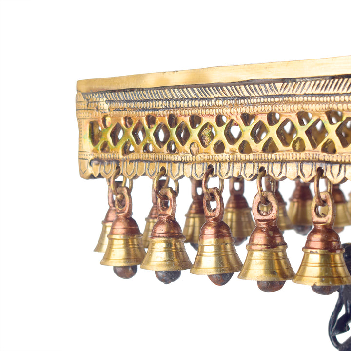 Large Brass Idol of 23 Inch Brass Chowki on Elephant with Hanging Bells. This 23 Inch Brass Chowki on Elephant with Hanging Bells is a stunning blend of artistry and tradition. Crafted from high-quality brass, the intricate detailing of the elephant and the delicately suspended bells add a touch of elegance to any space.