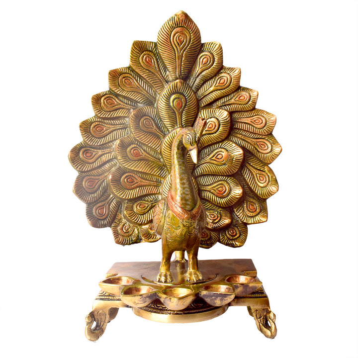 Satvik Stores Presents Stylish Peacock Panch Diya. Any festive occasion will be made wonderfully auspicious by the grace and beauty of the Peacock Brass Handcrafted Hanging Diya. Given that it was made by hand, the piece's abnormalities and flaws only serve to enhance Diya's allure and charisma.