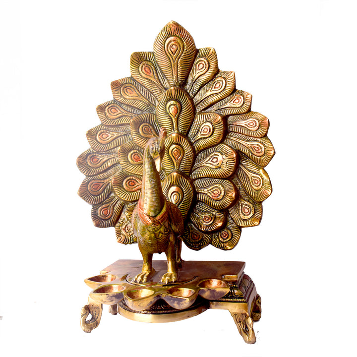 Satvik Stores Presents Stylish Peacock Panch Diya. Any festive occasion will be made wonderfully auspicious by the grace and beauty of the Peacock Brass Handcrafted Hanging Diya. Given that it was made by hand, the piece's abnormalities and flaws only serve to enhance Diya's allure and charisma.
