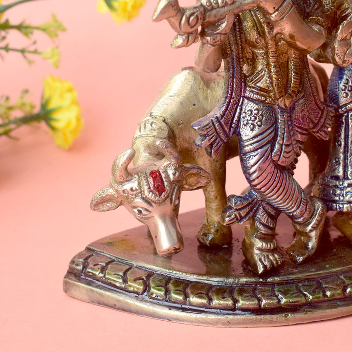 The 5.5 Inch Divine Radha Krishna with Kamdhenu Cow Idol is a captivating symbol of eternal love, harmony, and divine blessings. This beautifully crafted idol features Radha and Krishna in a serene pose, with Krishna playing his mesmerizing flute and Radha standing gracefully by his side.