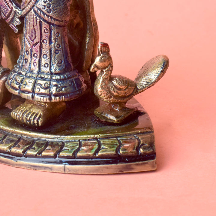 The 5.5 Inch Divine Radha Krishna with Kamdhenu Cow Idol is a captivating symbol of eternal love, harmony, and divine blessings. This beautifully crafted idol features Radha and Krishna in a serene pose, with Krishna playing his mesmerizing flute and Radha standing gracefully by his side.