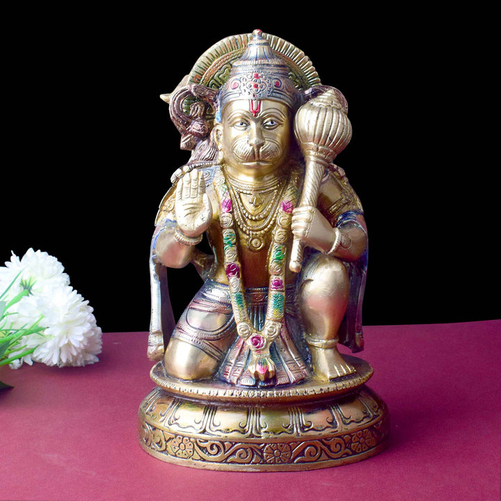 The "10.6 Inch Brass Hanuman Idol β Protector of Courage and Faith" is a stunningly detailed representation of Lord Hanuman, the embodiment of strength, devotion, and unwavering courage.