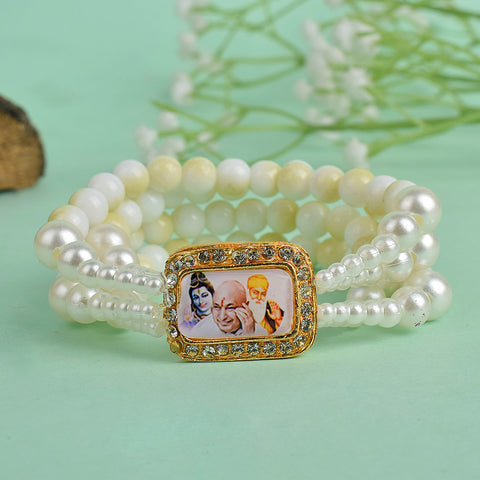 Yellow & White Marble with White Pearl Four Layer Guruji Swaroop Bracelet featuring vibrant yellow beads, elegant white marble effect beads, and luminous white pearls with Jai Guruji Swaroop β perfect for spiritual wear, festive gifting, and daily devotion. Indiaβs Largest Pooja Accessories Brand β www.satvikstore.in