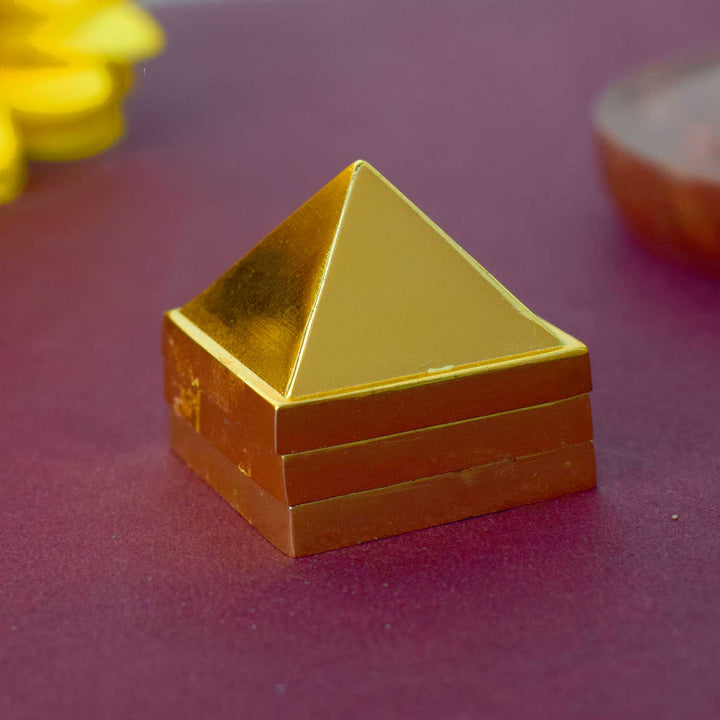 Brass Vastu Pyramid (Vastu Devta Yantra) featuring 45 deity zones, designed to balance energy flow, correct Vastu dosh, and bring prosperity and peace to any space.
Indiaβs Largest Pooja Accessories Brand - www.satvikstore.in