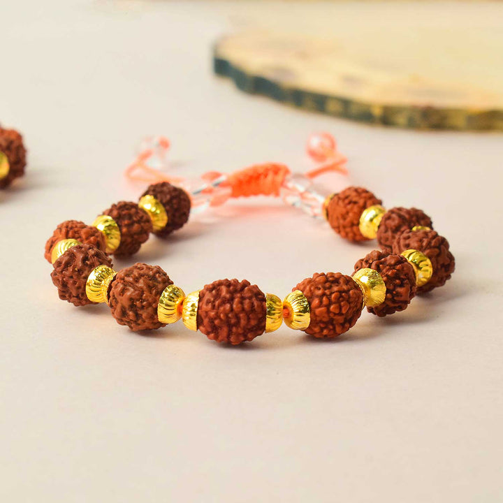 Certified dark brown rudraksha bracelet with golden brass capping for spiritual healing and protection. India’s Premium Rudraksha Jap Mala Store- www.satvikstore.in