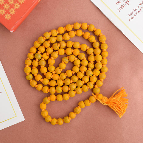 Natural Haldi (Turmeric) Jaap Mala, featuring vibrant turmeric-colored beads strung together, traditionally used for meditation, mantra chanting, and spiritual practices. Indiaβs Premium Jap Mala Store- www.satvikstore.in