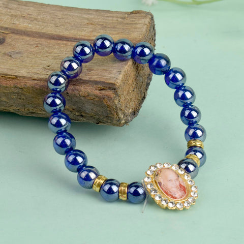Dark Blue Shiny Beads Single Layer Guruji Swaroop Bracelet featuring shimmering dark blue beads and Jai Guruji Swaroop β perfect for minimalist spiritual wear, meditation, and gifting. Indiaβs Largest Pooja Accessories Brand β www.satvikstore.in