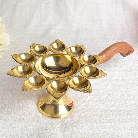 Dasmukhi Aarti Diya with Wooden Handle β Ten-wick brass diya with sturdy wooden handle for grand temple and home rituals. Indiaβs Largest Pooja Accessories Brand β www.satvikstore.in