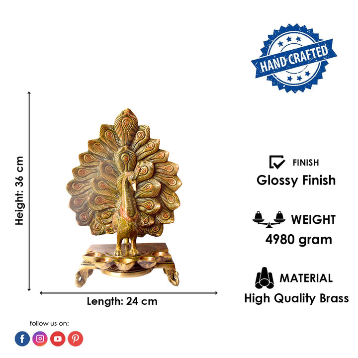 Satvik Stores Presents Stylish Peacock Panch Diya. Any festive occasion will be made wonderfully auspicious by the grace and beauty of the Peacock Brass Handcrafted Hanging Diya. Given that it was made by hand, the piece's abnormalities and flaws only serve to enhance Diya's allure and charisma.