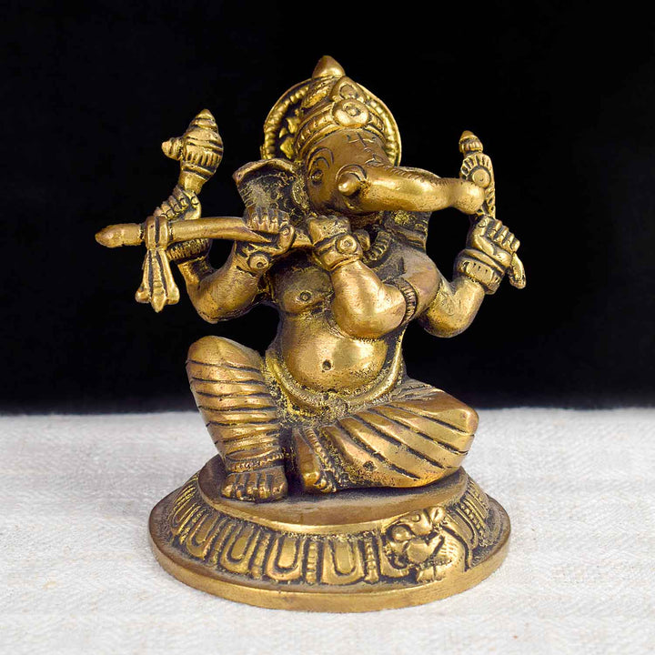 3.1 Inch Divine Brass Ganesha Statue playing flute, beautifully crafted with serene expression and traditional detailing β ideal for spiritual dΓ©cor, gifting, and festive worship. No.1 Brass Idol Store www.satvikstore.in