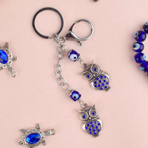 Double Owl Evil Eye Keychain β A protective and spiritual charm with twin owls for wisdom and positivity. Indiaβs Largest Pooja Accessories Brand β www.satvikstore.in