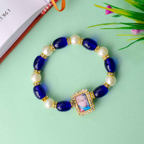Elegant Guruji Swaroop Bracelet made with blue and white pearls for divine connection and spiritual elegance. Indiaβs Largest Pooja Accessories Brand β www.satvikstore.in