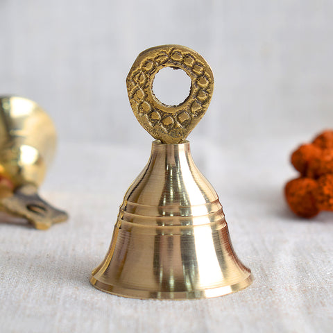 Elegant brass pooja bell with intricate design, symbolizing spiritual harmony and traditionally used during Hindu rituals and temple ceremonies. Indiaβs Largest Pooja Accessories Brand β www.satvikstore.in