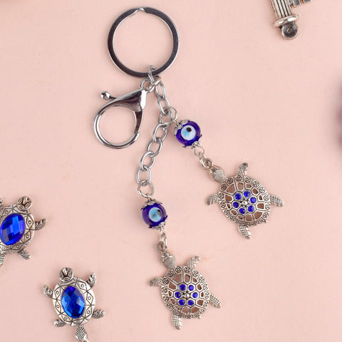 Evil Eye 2 Tier Turtle Metal Keychain β A Feng Shui good luck charm symbolizing longevity, stability, and protection. Indiaβs Largest Pooja Accessories Brand β www.satvikstore.in