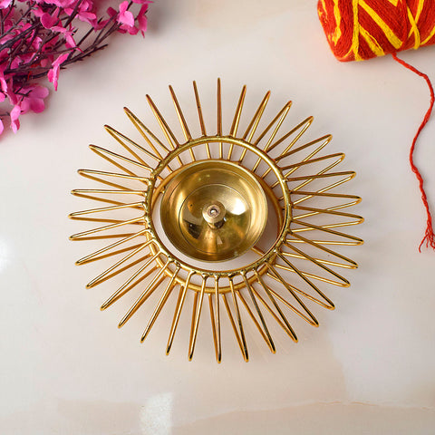 Gold-toned decorative Akhand Sun Shape Brass Diya featuring a radiant Surya (sun) motif and eternal flame chamber, ideal for spiritual lighting and festive dΓ©cor. Indiaβs Largest Pooja Accessories Brand β www.satvikstore.in