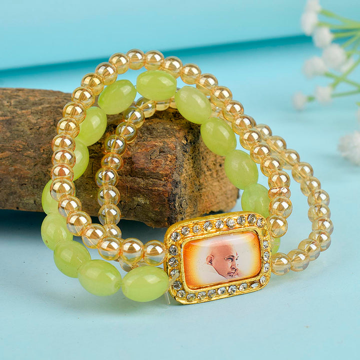 Golden Clear & Green Triple Layer Guruji Swaroop Bracelet featuring sparkling golden clear beads with vibrant green middle layer and Jai Guruji Swaroop β perfect for spiritual wear, meditation, and gifting. Indiaβs Largest Pooja Accessories Brand β www.satvikstore.in