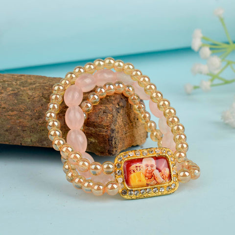 Golden Clear & Pink Triple Layer Guruji Swaroop Bracelet featuring sparkling golden clear beads with soft pink middle layer and Jai Guruji Swaroop β perfect for spiritual wear, meditation, and gifting. Indiaβs Largest Pooja Accessories Brand β www.satvikstore.in