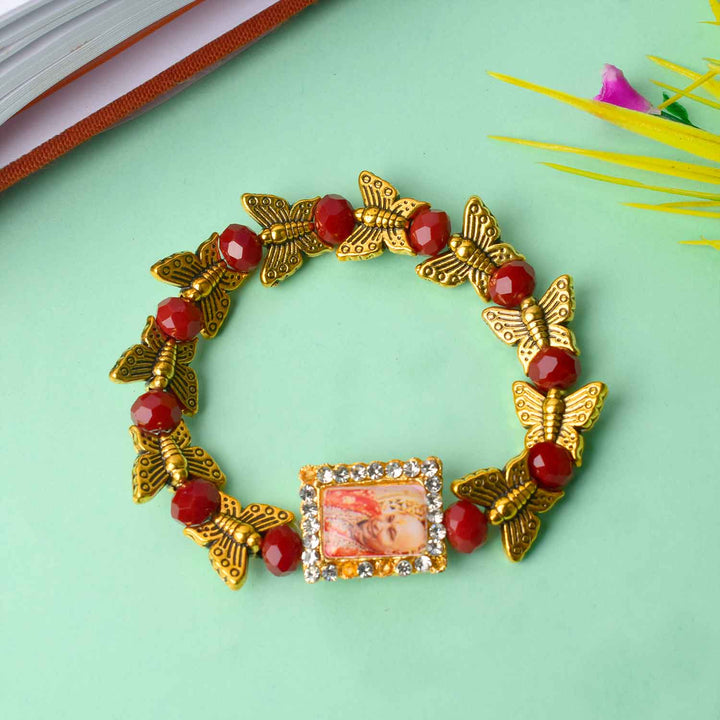 Handcrafted Guruji Swaroop Bracelet with golden butterfly charms and black-red colored beads, ideal for spiritual wear and gifting. India’s Largest Pooja Accessories Brand – www.satvikstore.in