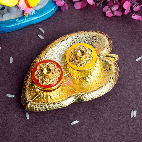 Leaf-shaped kumkum dispenser designed for rituals and pooja use, showcasing intricate craftsmanship and a traditional aesthetic for spiritual settings. Indiaβs Largest Pooja Accessories Brand β www.satvikstore.in