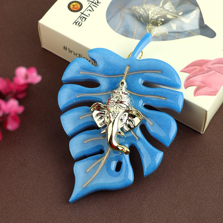 Elegant classic finish wall hanging featuring Lord Ganesha seated on a detailed leaf design, perfect for spiritual home decor and festive celebrations. India’s Largest Pooja Accessories Brand – www.satvikstore.in