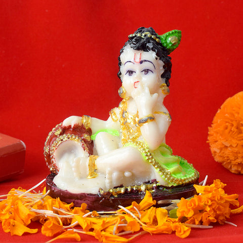 Marble Laddu Gopal Statue - A finely detailed marble statue of Laddu Gopal, depicting Lord Krishna in his childhood form, holding a laddu in his hand. This intricately designed idol symbolizes the playful and divine nature of Lord Krishna. Indiaβs Largest Pooja Accessories Brand β www.satvikstore.in
