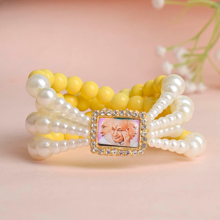 Pale Yellow with White Pearl Four Layer Guruji Swaroop Bracelet featuring soft pale yellow beads and radiant white pearls with Jai Guruji Swaroop – perfect for spiritual wear, festive gifting, and daily devotion. India’s Largest Pooja Accessories Brand – www.satvikstore.in