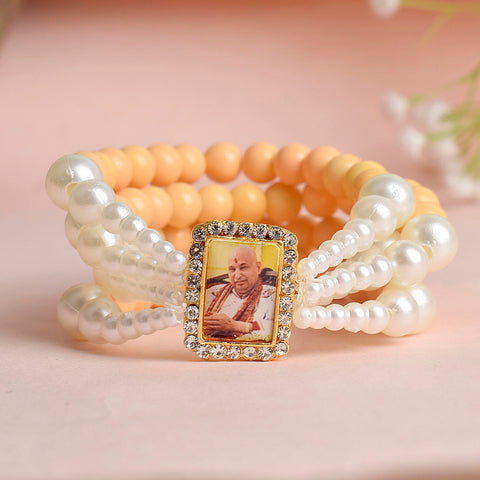 Pastel Yellow & White Pearl Four Layer Guruji Swaroop Bracelet featuring soft pastel yellow beads and luminous white pearls with Jai Guruji Swaroop β perfect for spiritual wear, festive gifting, and daily devotion. Indiaβs Largest Pooja Accessories Brand β www.satvikstore.in