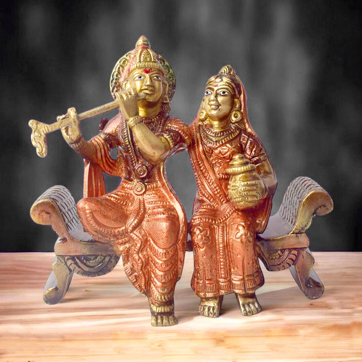 The 4.7 Inch Graceful Sitting Radha Krishna on Bench β A Spiritual Masterpiece is a beautifully crafted idol that captures the essence of divine love and serenity. This exquisite piece features Radha and Krishna seated gracefully on a bench, symbolizing their eternal bond and peaceful companionship. Krishna, with his flute, and Radha, with a serene expression, reflect the harmonious union of the divine couple.