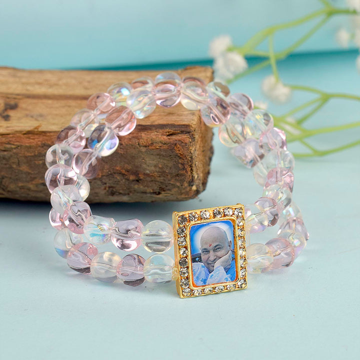 Pink & Clear Shiny Beads Double Layer Guruji Swaroop Bracelet featuring delicate pink and luminous clear beads with Jai Guruji Swaroop β perfect for spiritual wear, festive gifting, and daily devotion. Indiaβs Largest Pooja Accessories Brand β www.satvikstore.in