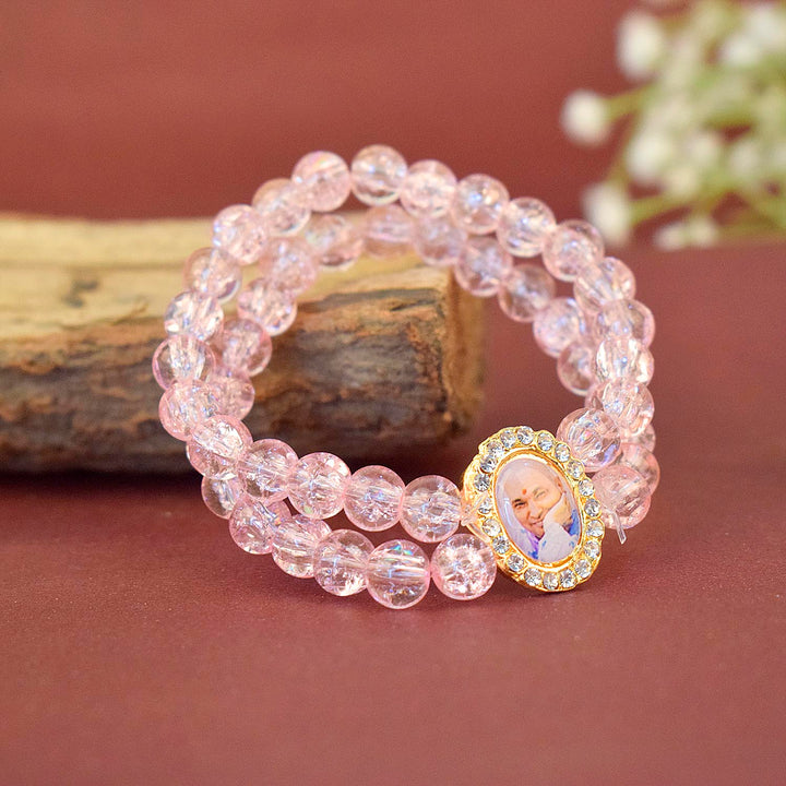 Pink Shiny Beads Double Layer Guruji Swaroop Bracelet featuring two layers of delicate pink beads and Jai Guruji Swaroop β perfect for spiritual wear, festive gifting, and daily devotion. Indiaβs Largest Pooja Accessories Brand β www.satvikstore.in