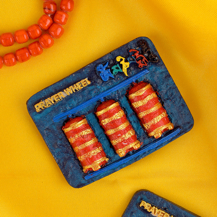 Prayer Wheel Buddha Fridge Magnet, featuring a spiritual prayer wheel and Buddha design, bringing positive energy, peace, and serenity to your home or office. Indiaβs Largest Pooja Accessories Brand β www.satvikstore.in